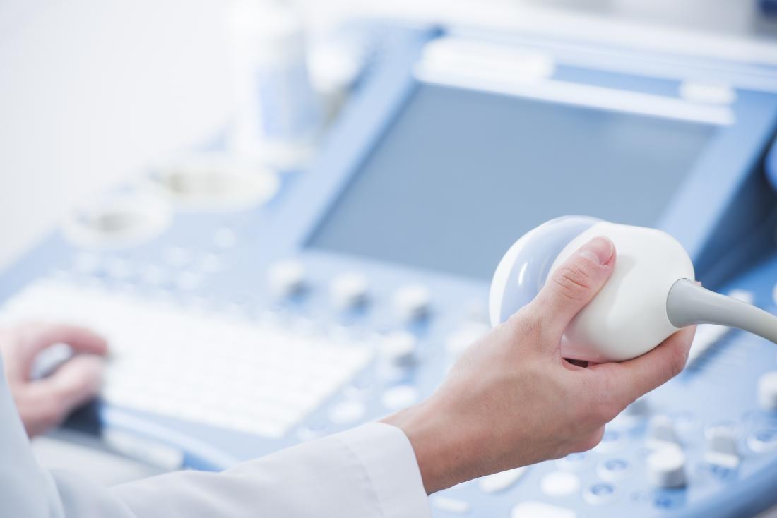 Testicular ultrasound being performed